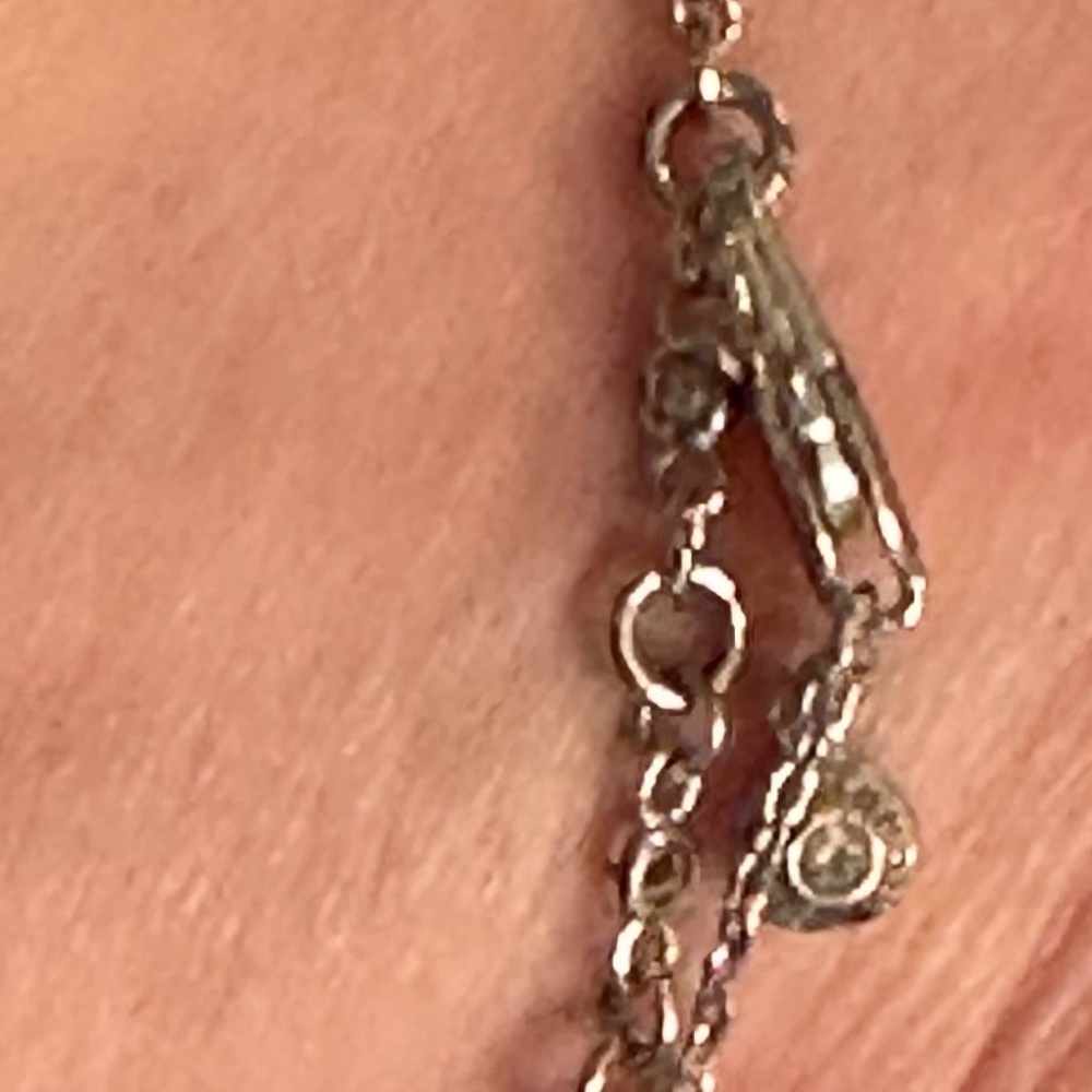 Gorgeous HENRI BENDEL Sparkly Rhinestone, Silver Infinity Bracelet - Picture 9 of 11